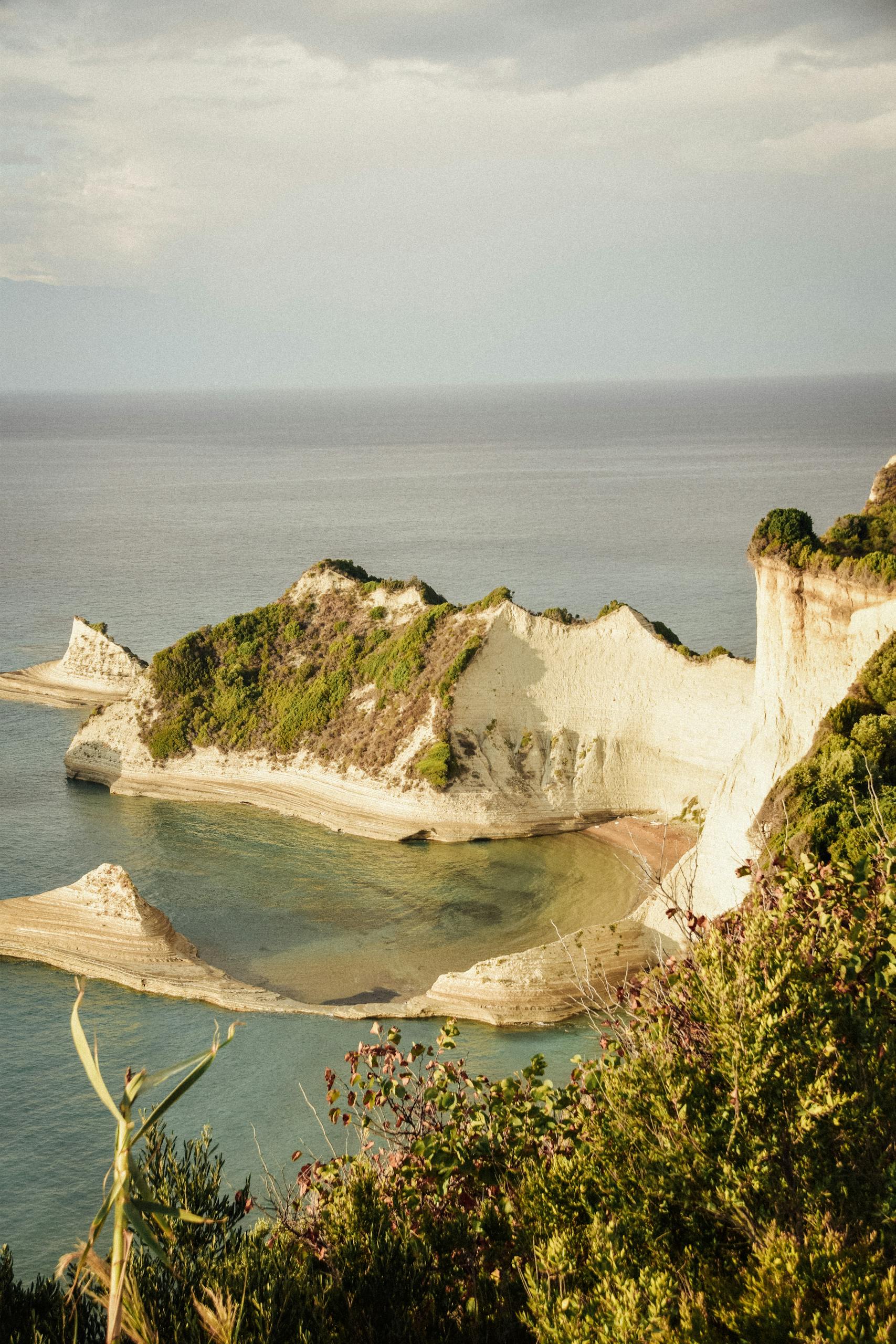 Stunning view of cliffs and sea in Corfu, Greece, captured in a serene landscape setting.